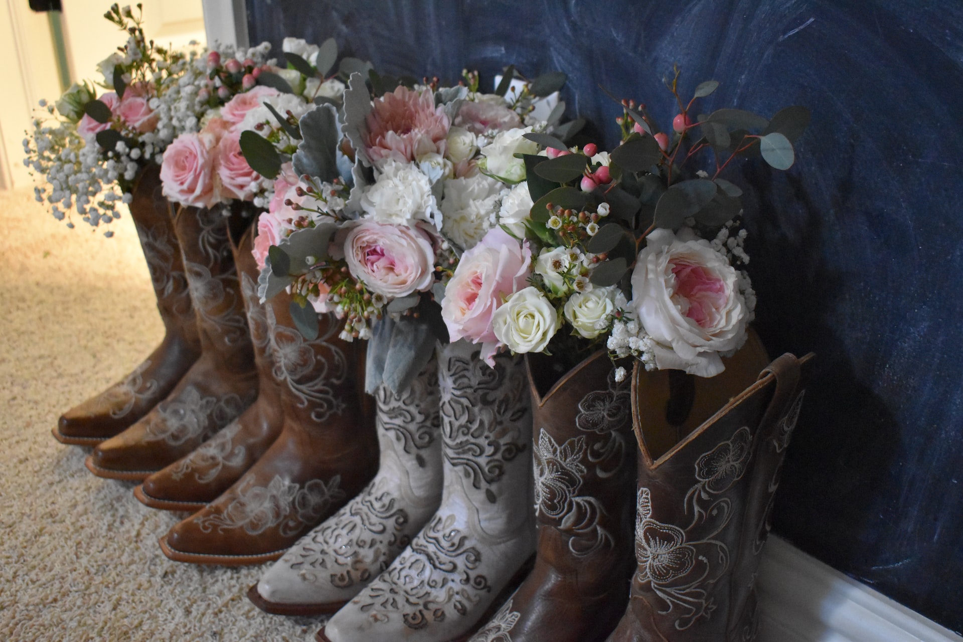 Flowers sticking out of cowboy boots