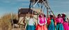 A group of Andes women standing near tower