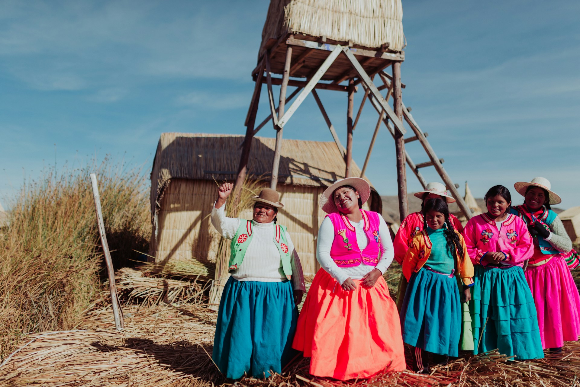 A group of Andes women standing near tower