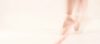 a blurred image of a ballerina's legs