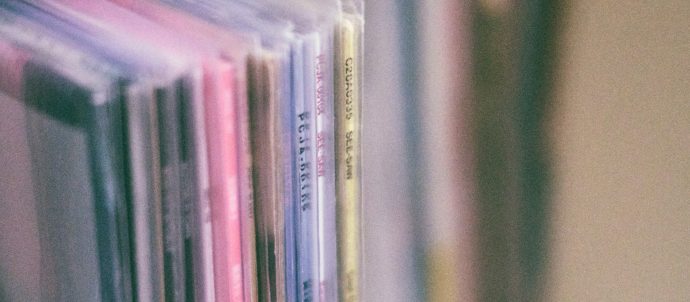 blurry close up of record spines