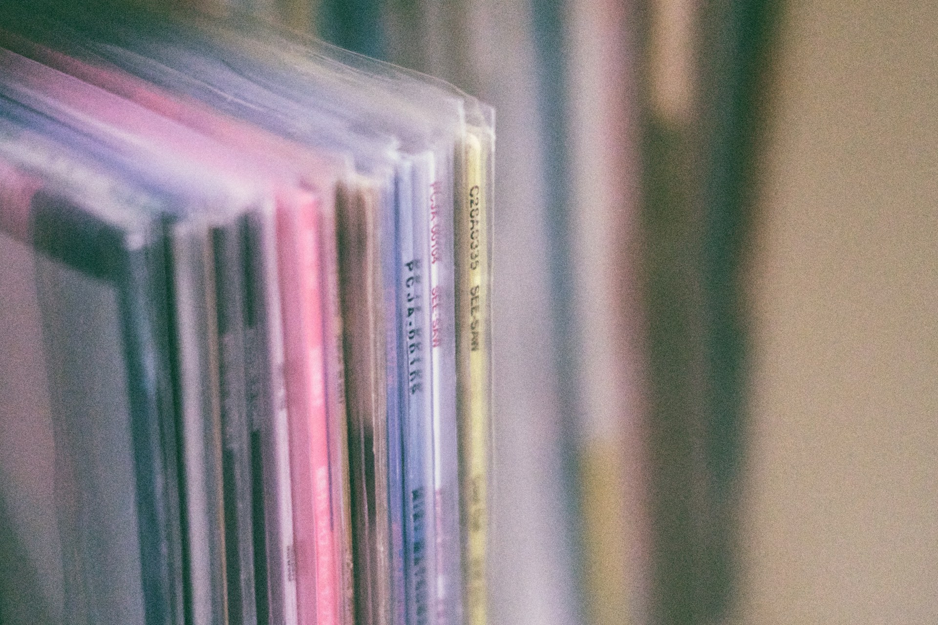 blurry close up of record spines