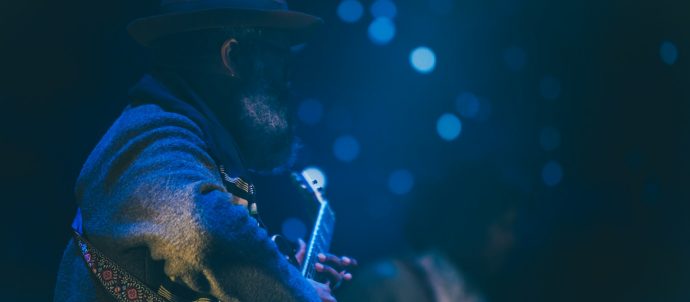 A blues musician in blues light