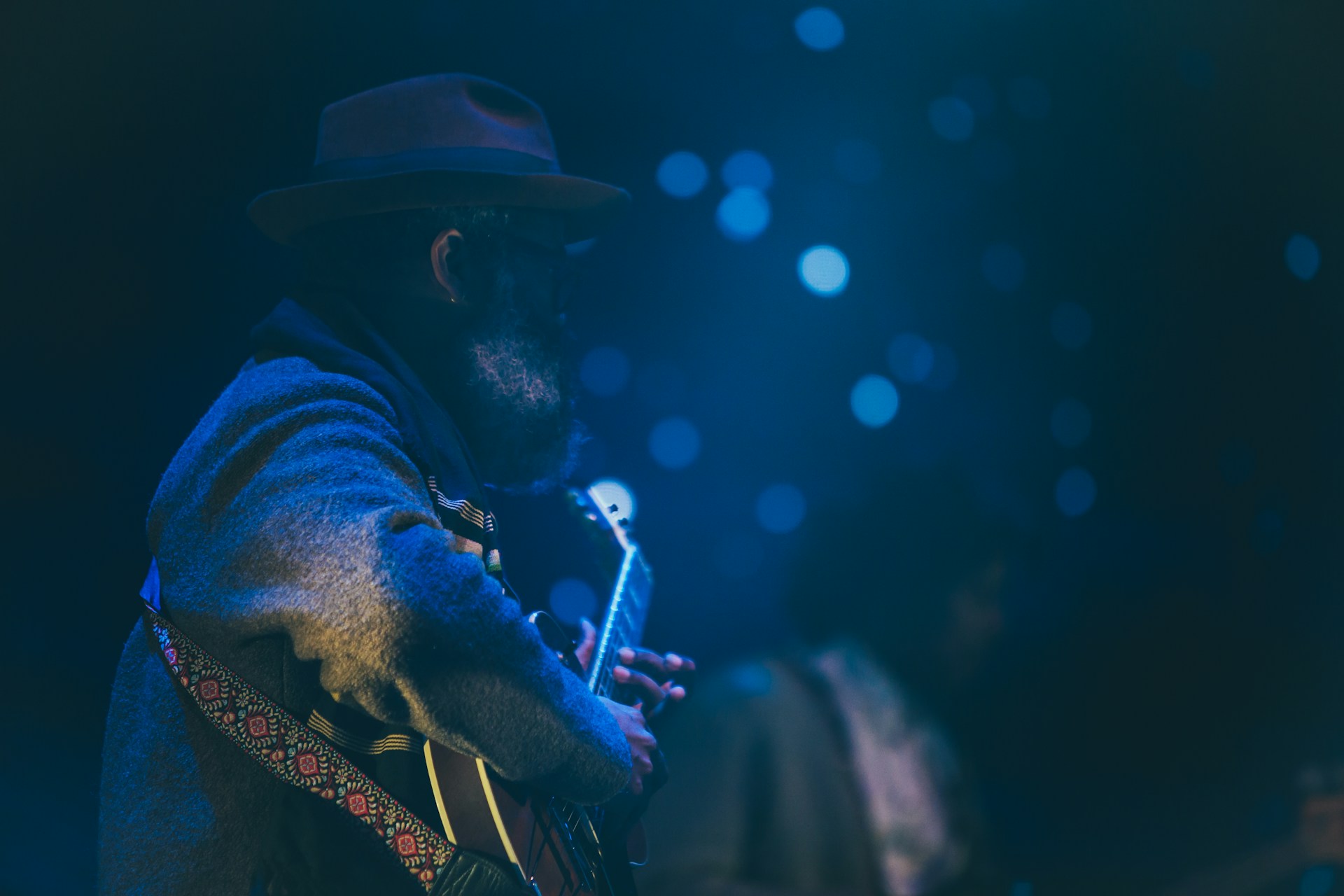 A blues musician in blues light